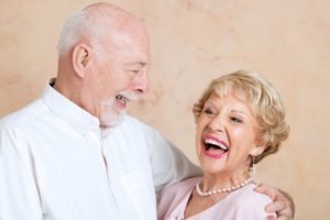 older couple embracing and laughing