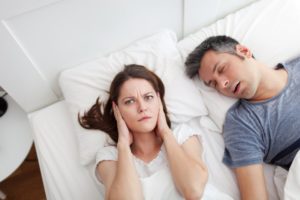 woman angry at husband for snoring